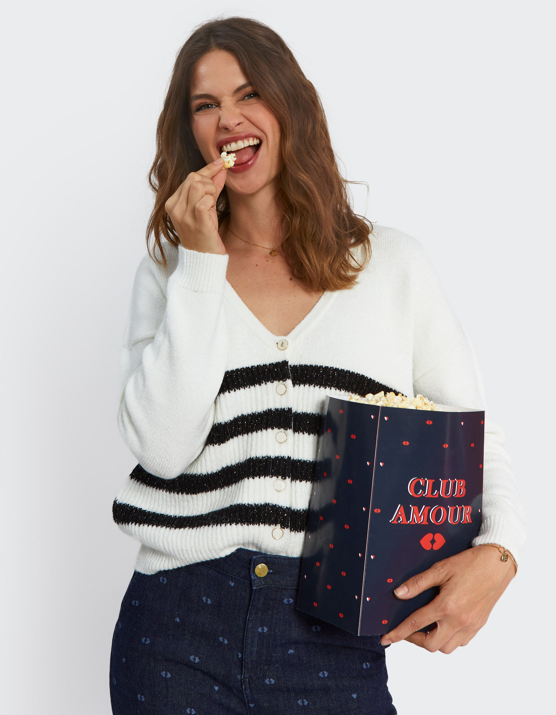 White cardigan shop with black stripes